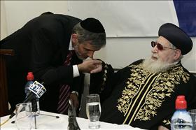 Interior Minister, Eli Yishai kissing the hand of the leader of Shas, Rabbi Ovadia Yosef. 14.12.2009. Photo: Abir Sultan, Flash 90 