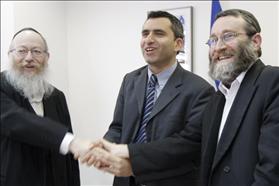 Chairman of the Coalition Management Ze'ev Elkin from the Likud, at the center, shaking hands with Knesset Members Moshe Gafni and Yaakov Litzman from Yahadut Hatora after signing the coalitional  agreement between the two parties. 14.1.2009. Photograph: Miriam Elster, Flash 90.