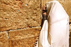 A Jew praying at the Western Wall; source: Wikipedia