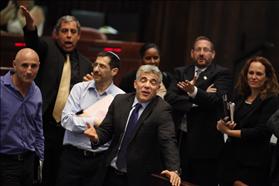 The Minister of Finance Yair Lapid at the Knesset gathering where the State's budget was approved in the second and third reading, for the years 2013 - 2014 (b). 29-07-2013. Photo: Flash 90