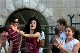 Secular women singing and dancing opposite a haredi shabat demonstration in Jerusalem. 23.07.2011. Photograph by: Kobi Gideon, Flash 90.