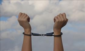 A woman's chained hands