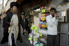 Haredim forcing market owners to close their shops at the Machaneh Yehuda market before Shabbat. 12.12.2009. Photo: Matanya Flash 90 Haredim forcing market owners to close their shops at the Machaneh Yehuda market before Shabbat. 12.12.2009. Photo: Matanya Flash 90